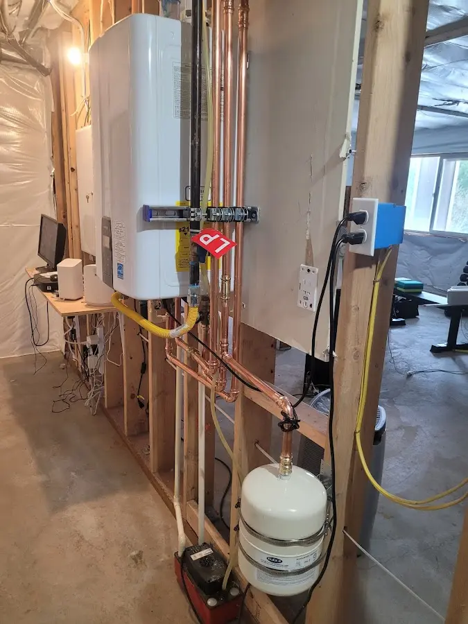 Licensed plumber repairing a kitchen sink in Double Oak